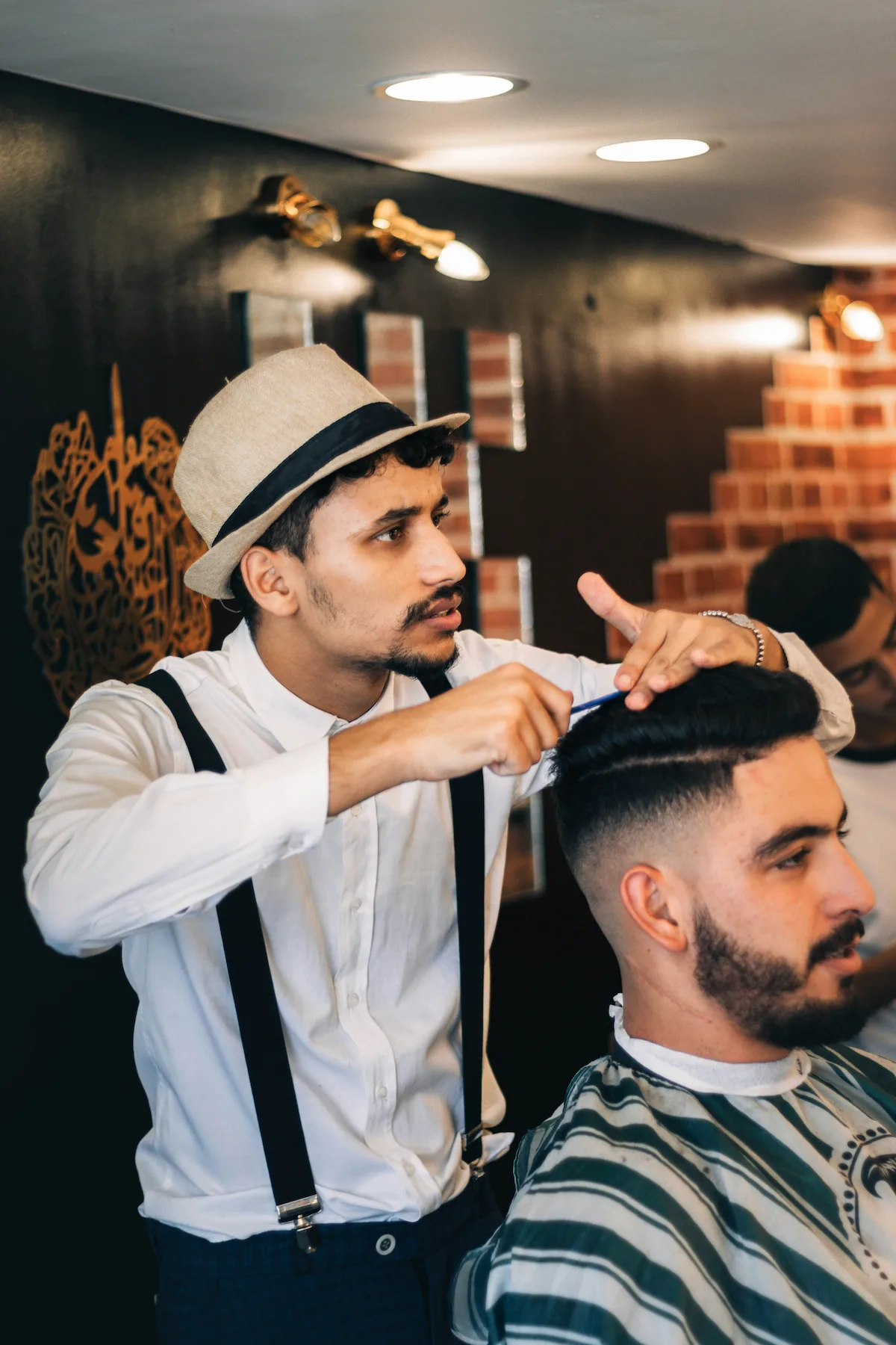 Carlos Mendez cutting a fade at Urban Cutz barbershop